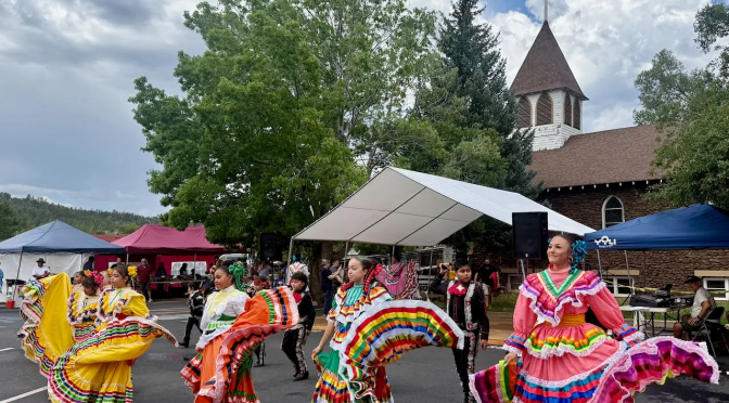 Neither bright sunshine nor pouring rain deterred community from celebrating 11th annual Flagstaff Summertime Tardeada on Aug. 1, 2026